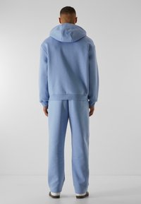 9N1M SENSE SENSE ESSENTIAL FLUFFY - Treniņtērpa apakšdaļas - powderblue