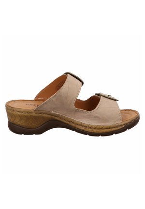 Beige leather sandal featuring two wide straps, a decorative buckle, and a contoured wedge sole with a patterned finish.