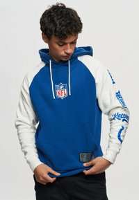 NFL hoodie featuring blue body and white raglan sleeves. Front pocket and logo on chest, with printed text on sleeve. Cotton blend material.