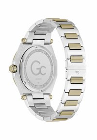 Sudraba un zelta nerūsējošā tērauda rokaspulkstenis ar astoņstūrainu korpusu, safīra kristālu un teksturētu metāla aproci ar maiņojošiem saitēm.