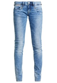 Ljusblå denim skinny jeans med medelhög midja, fem fickor och subtila blekningar. Metallknapp och dragkedjestängning framtill.