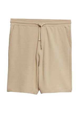 Beżowe teksturowane szorty dzianinowe z elastycznym pasem i sznurkiem, z bocznymi kieszeniami, ułożone na płasko na białym tle.