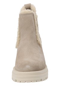 Beige suède enkelaarsen met nepbontvoering en een textuurcrème zool, voorzien van een trekhaak aan de achterkant en een gladde afwerking.