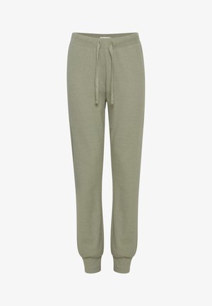 Svetlo zeleni trenerki iz mehkega blaga, z elastičnim pasom, nastavljivim vrvico in rebrastimi manšetami na gležnjih.