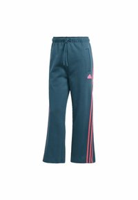 Tyrkysové dámské tepláky s elastickým páskem na stažení, bočními kapsami a růžovými pruhy po stranách. Na levém stehně je logo Adidas.