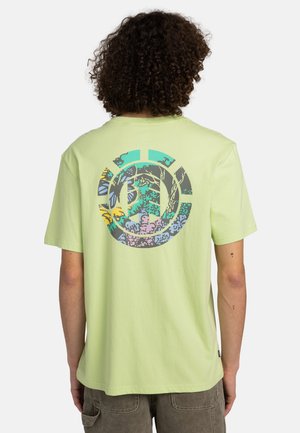 Short-sleeve, light green t-shirt featuring a multicolored graphic design on the back with nature motifs, butterflies, and abstract shapes.