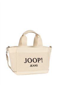 Płócienna torba na ramię w kolorze beżowym z dwoma uchwytami i odpinanym paskiem na ramię. Na jednej stronie haftowane logo „JOOP! JEANS”.
