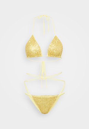 Yellow sequined bikini set featuring a triangular top and minimal coverage bottom, both adorned with shiny, reflective sequins.