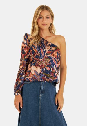 Top monospalla con vivace motivo floreale in blu, rosa e arancione, caratterizzato da una vestibilità ampia e manica lunga da un lato.