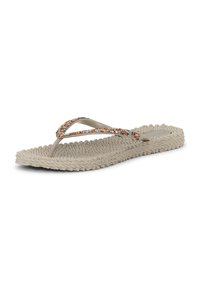 Beige gestructureerde teenslipper met dunne bandjes versierd met meerkleurige edelstenen op een witte achtergrond.
