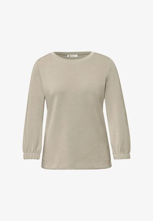 Maglia beige a maniche lunghe con scollo rotondo e polsini elasticizzati, design semplice, mostrata su sfondo bianco.