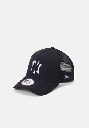 Black baseball cap with a mesh back, featuring an embroidered white logo on the front, adjustable strap, and curved visor.