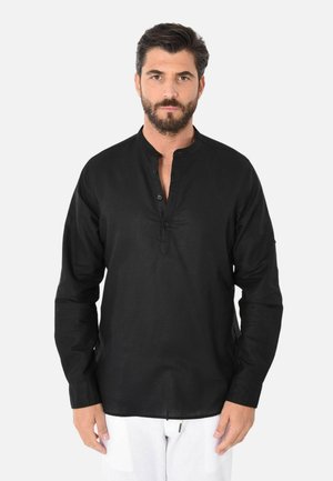 Camicia nera in lino con colletto alla mandarino, patta con bottoni e maniche lunghe. Texture liscia e orlo dritto con spacchi laterali.