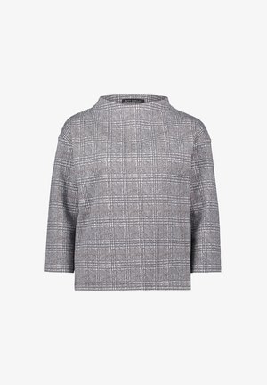 Grijs geruit bovenstuk met een losse pasvorm, een ronde halslijn en driekwart mouwen. Gemaakt van een gestructureerde stof met subtiele witte en bruine accenten.