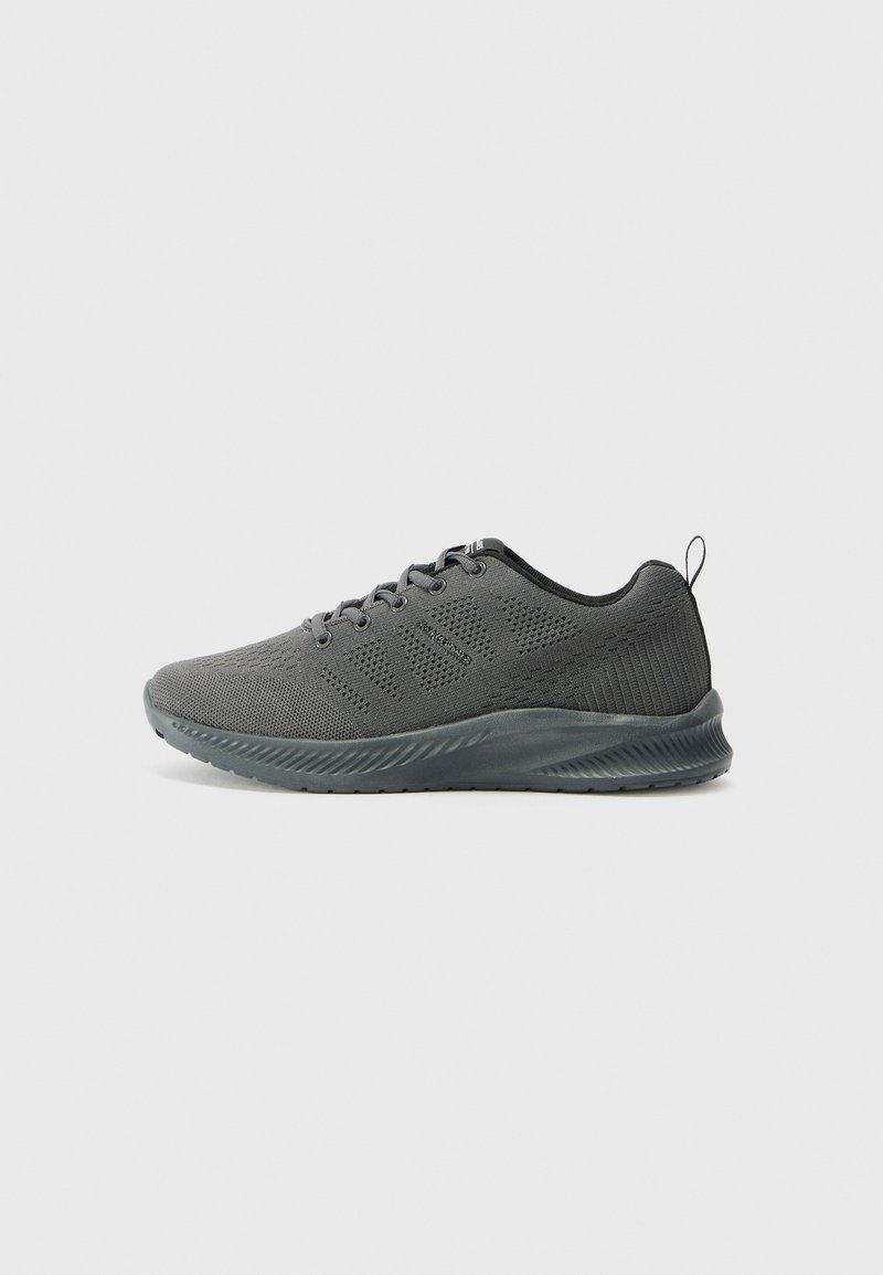 Gray athletic shoes with a breathable mesh upper, textured sides, and a flexible rubber sole. Features lace-up closure and pull-tab.