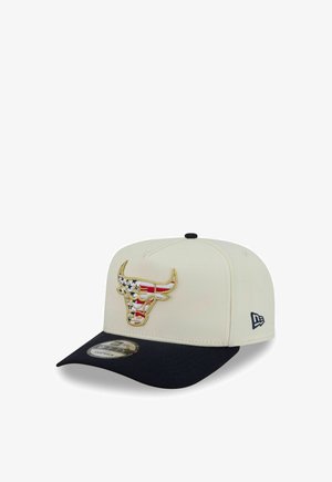 White and black snapback cap with a bull logo featuring American flag stars and stripes embroidery on the front.