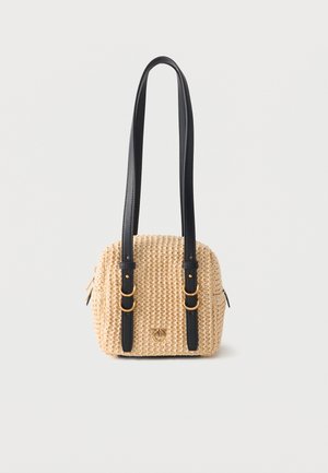 Small woven beige handbag with long black leather straps, gold buckle details, and a zipper closure on a white background.