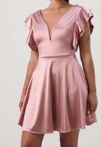 Pink satin dress with a deep V-neck and ruffled sleeves, featuring a fitted bodice and a flared skirt that falls above the knees.
