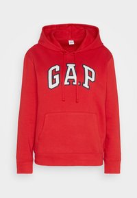 Sudadera roja hecha de una mezcla de algodón, con un bolsillo tipo canguro, capucha con cordón y un audaz logotipo de "G.A.P." en blanco y azul marino.