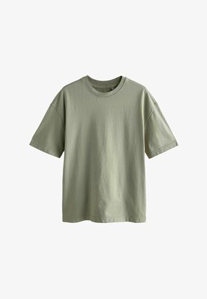 Rövid ujjú, kerek nyakú póló világos olívazöld pamutból. Laid back szabással és sima, enyhén texturált anyaggal rendelkezik. Minták vagy díszítések nélkül.