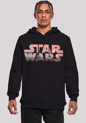 Black hoodie featuring a large, stylized "STAR WARS" logo in pink with a scenic graphic. Material appears soft with a kangaroo pocket.