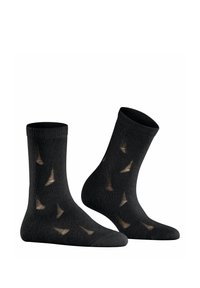 Schwarze Socken mit einem gerippten Bund und ausgeschnittenen dreieckigen Mustern, die eine hellere braune Farbe zeigen. Glatte Textur und Design in Knöchellänge.