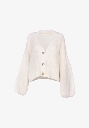 Cardigan court beige en tissu tricoté, avec un décolleté en V, des manches longues ballon et trois boutons décoratifs en ton doré.