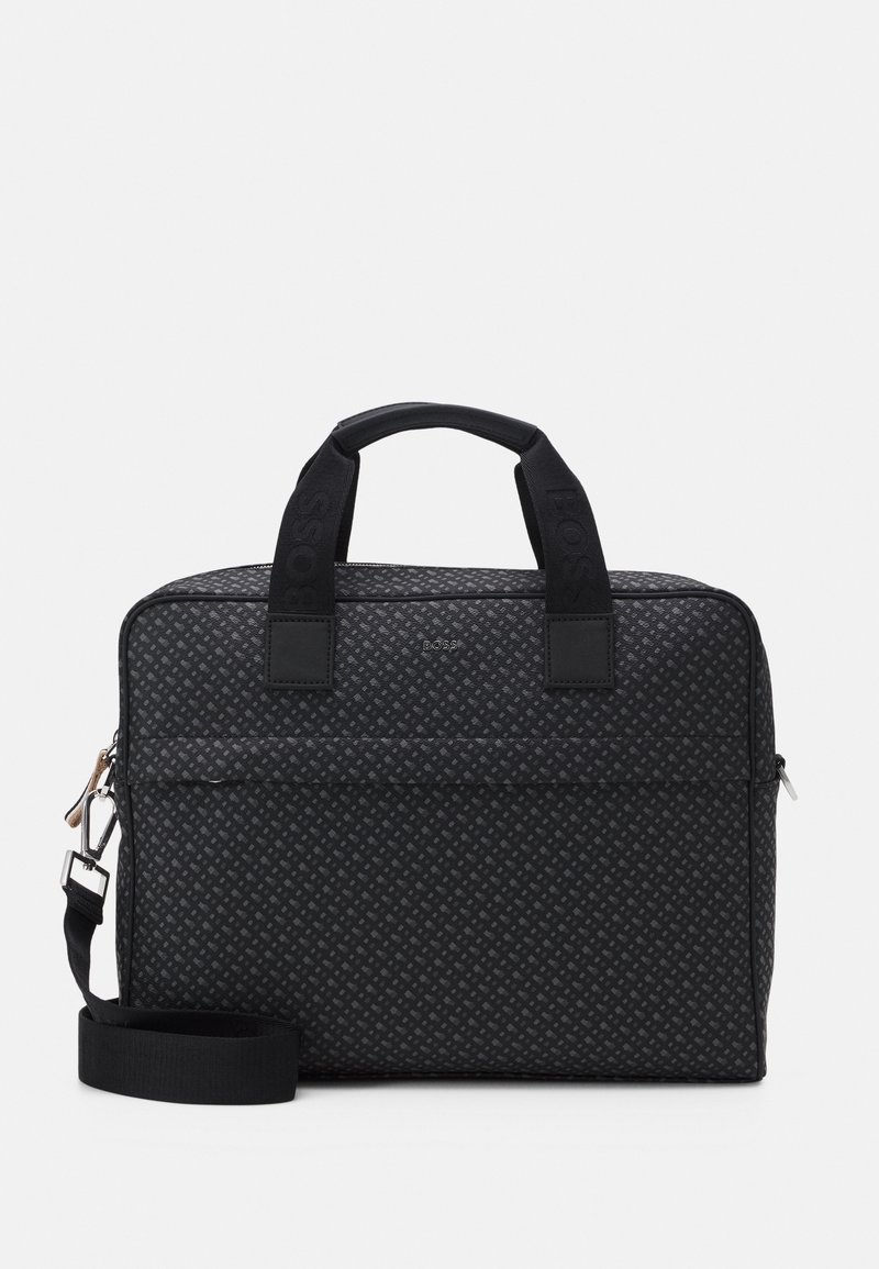 Black patterned laptop bag with dual top handles and an adjustable shoulder strap. Features a zip closure and a front pocket. Textured fabric.