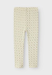 Ribētie legingi viegliem bežiem, ar dimanta rakstu un nelielām zelta akcentiem. Gluda tekstūra un pieguļošs piegriezums, nav redzamu aizdaru.