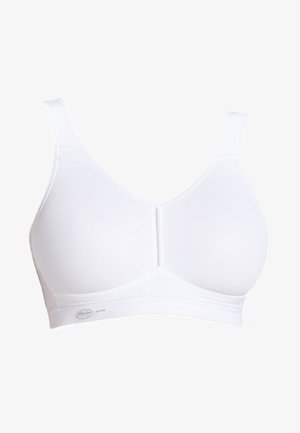 Witte sportbeha met naadloos ontwerp, verstelbare banden en zachte stof. Kenmerkt zich door een driehoekige vorm en minimale stikdetails. Schone lijnen.