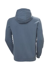 Sudadera con capucha en suave y texturizada tela azul oscura. Presenta un bolsillo tipo canguro, puños y dobladillo acanalados, y un diseño de corte relajado.