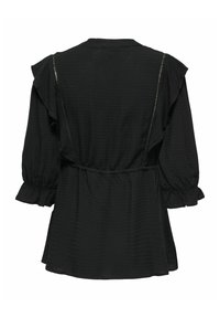 Blouse noire avec des manches courtes à volants, en tissu texturé, une taille ajustée et un bas fluide. Présente un motif en zigzag subtil. Vue arrière.