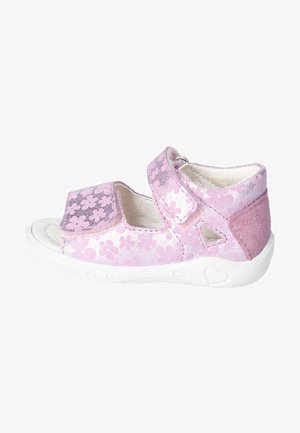 Sandalo rosa con motivo floreale, cinturini in velcro, materiale morbido, suole bianche, dettagli in camoscio, design aperto per traspirabilità.