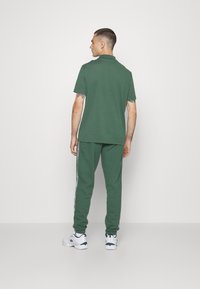 Lacoste Sport KURZARM - Polo - vert fonce
