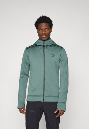 Hooded zip-up sweatshirt in muted green, featuring black accents, smooth texture, and logo on the chest. Long sleeves with thumbholes.