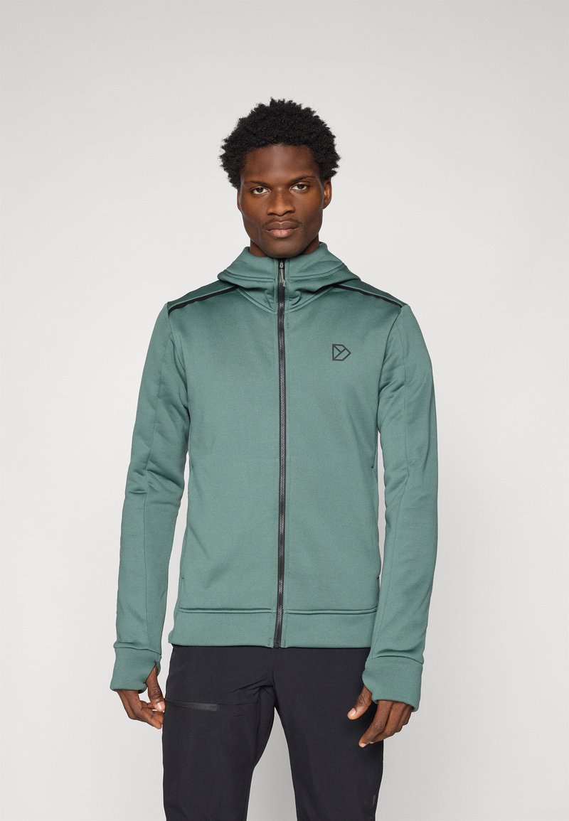 Kapuzensweatshirt mit Reißverschluss in sanftem Grün, mit schwarzen Akzenten, glatter Textur und Logo auf der Brust. Lange Ärmel mit Daumenlöchern.