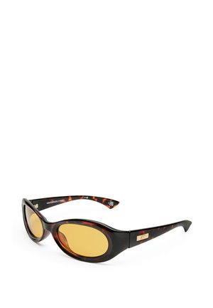 Tortoiseshell sunglasses with oval, yellow lenses. Smooth plastic frame, slight cat-eye shape, featuring a gold accent on the side.