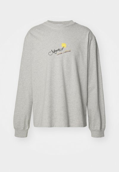 Gray long-sleeve sweatshirt with a loose fit, featuring embroidered text and a sun graphic on the front. Soft material with ribbed cuffs.