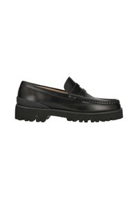 Mocassin en cuir noir avec une semelle crantée épaisse, une bride penny et un bout arrondi, présenté de profil sur un fond blanc.