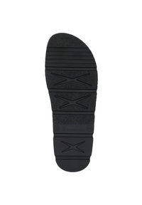 Black rubber shoe sole with textured surface, featuring horizontal ridges and an "X" pattern for traction. Rounded toe and logo detail.
