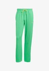 ZIP FLARE - Tracksuit bottoms - energy green