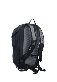 Black backpack with mesh panels, padded straps, and adjustable buckles. Features logo and multiple compartments for storage.