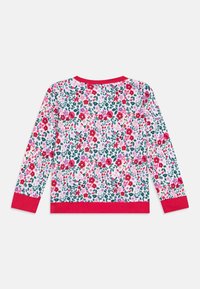 Floral long-sleeve shirt with a white base, featuring red, pink, and green flowers. Solid red cuffs and hem accentuate the design.