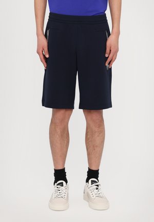 BERMUDA - Tracksuit bottoms - blue