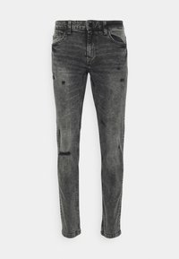Vaqueros skinny de lavado negro con ligeros detalles desgastados en las piernas delanteras y estilo clásico de cinco bolsillos.