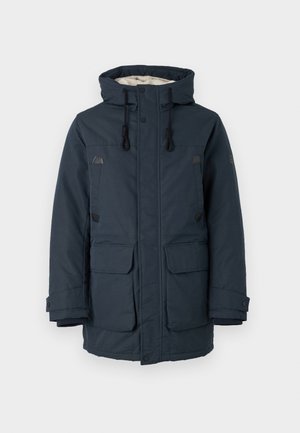 Giacca imbottita blu navy con colletto alto, fodera interna a contrasto, due grandi tasche frontali e dettagli metallici neri.