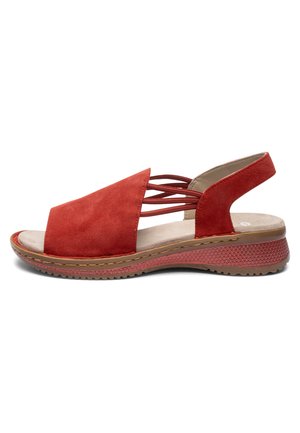Red suede open-toe sandal with elastic straps, cushioned beige insole, textured rubber sole, and low wedge heel for casual wear.