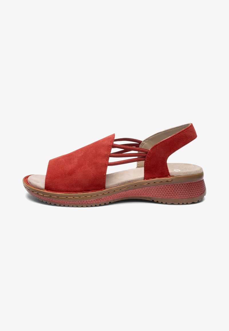 Red suede open-toe sandal with elastic straps, cushioned beige insole, textured rubber sole, and low wedge heel for casual wear.