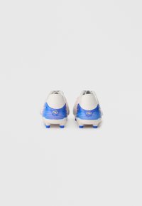 Football cleats with a white upper, blue and pink accents, and a smooth texture. Features a rounded heel and multiple blue studs on the sole.