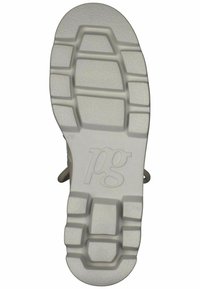 Suola della scarpa con una superficie in gomma bianca texturizzata, caratterizzata da un motivo a griglia, un'impronta del logo e forme variabili per una migliore aderenza.